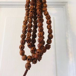 Antique East Asian wooden skull necklace